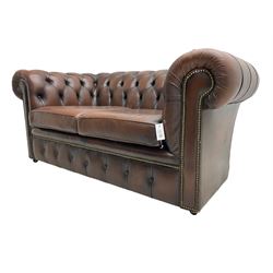 Chesterfield two seat sofa, upholstered in brown buttoned leather