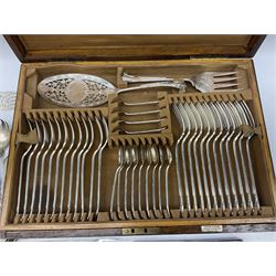 Oak cased Mappin & Webb part canteen of silver plated Scroll pattern cutlery, the box with twin brass drop handles to sides and vacant brass cartouche to the hinged cover, opening to reveal plaque and lining detailed 'Mappin & Webb', and three stackable fitted trays containing the part canteen, together with a small quantity of assorted and mostly silver plated flatware 