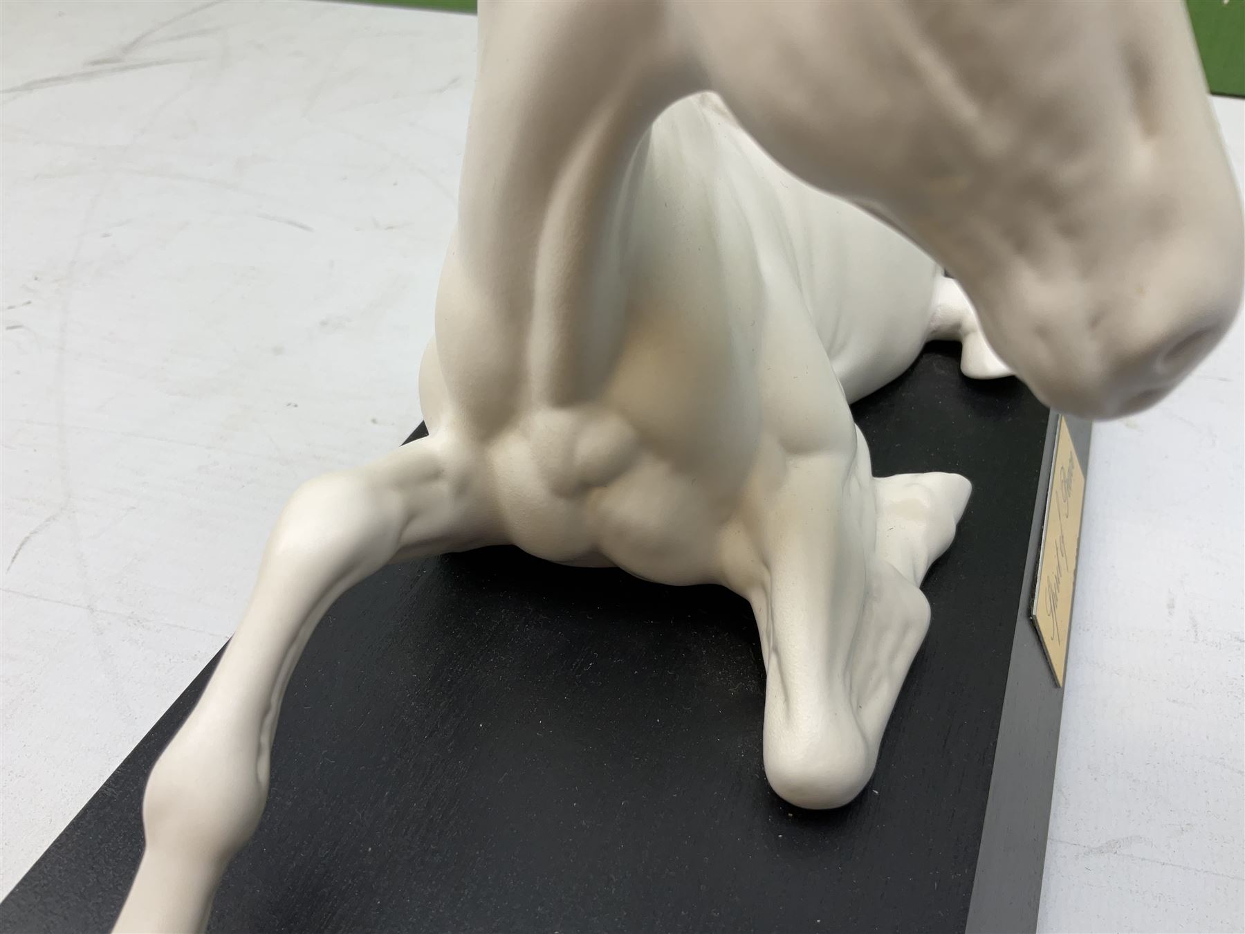 Five Beswick and Royal Doulton horse figures in matt white on black plinths, comprising of  Spirit of Affection no. 2689/2536, Springtime no.2837, Spirit of peace no.2916, Spirit of earth no.2914 and Spirit of the wild no. 183, together with a composite figure of a horse (6)