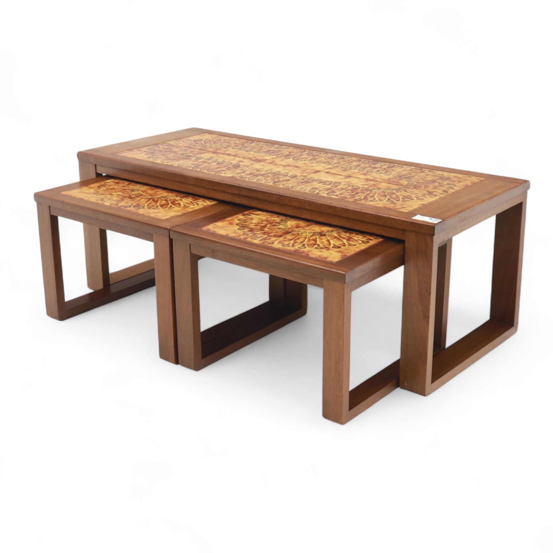 Mid-20th century ‘Long John’ teak nest of coffee tables, rectangular form with ceramic tile inset top, enclosing two smaller square tables with matching tile decoration