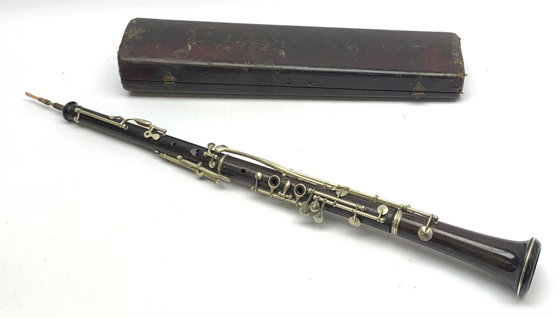 Rosewood threepiece oboe with nickel mounts, unmarked, cased Musical