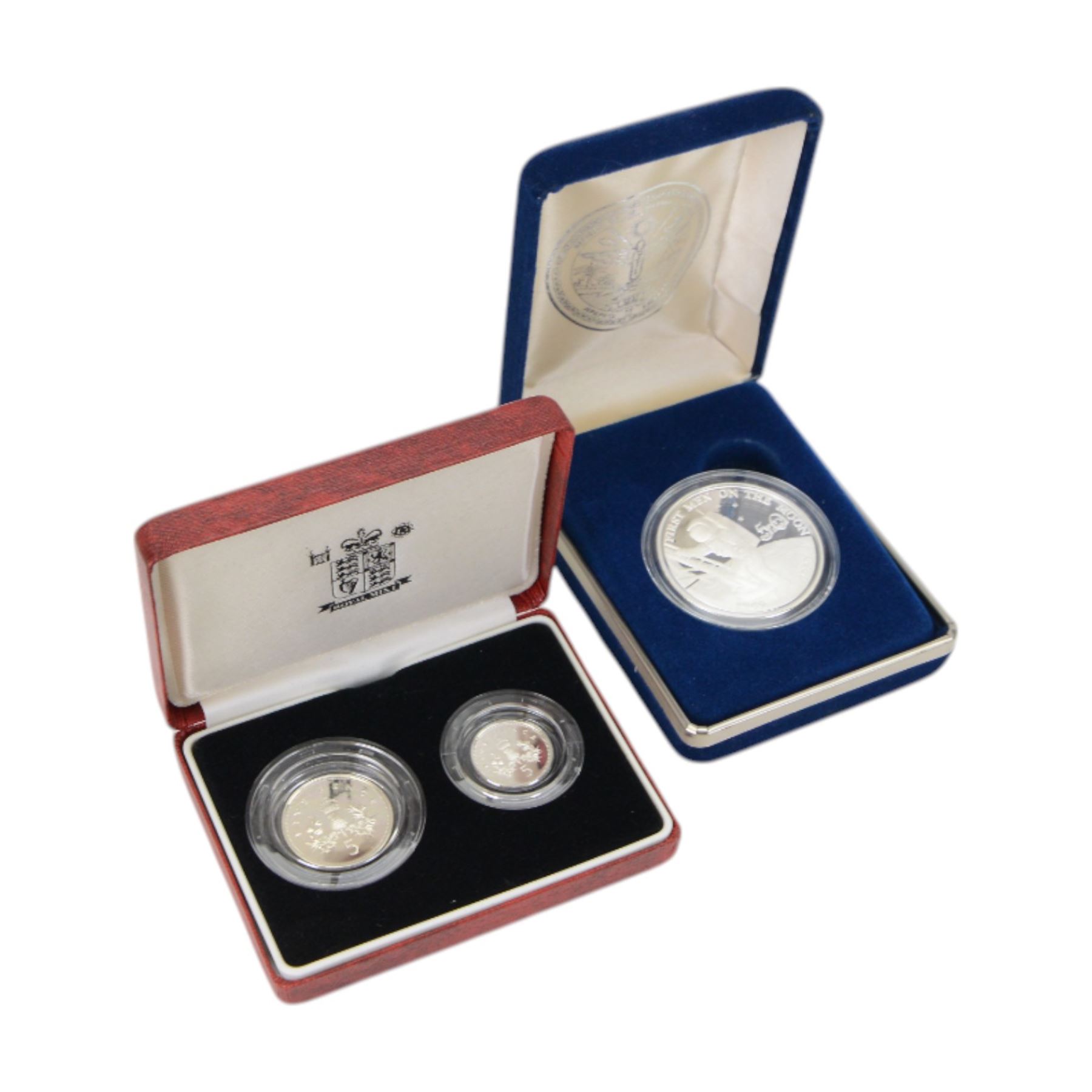 Three The Royal Mint United Kingdom silver coins, comprising 1990 silver proof five pence two coin set, 2011 'William and Catherine' silver proof five pound coin on cover, and 2014 'SS Gairsoppa Britannia' fine silver quarter ounce coin, together with 2013 'Christening of HRH Prince George of Cambridge' five pound brilliant uncirculated crown, 2003 'Coronation Anniversary' brilliant uncirculated five pound coin on cover, two 2005 'Horatio Nelson and the Battle of Trafalgar' uncirculated five pound coins on cover, and Marshall Islands 1989 silver proof crown