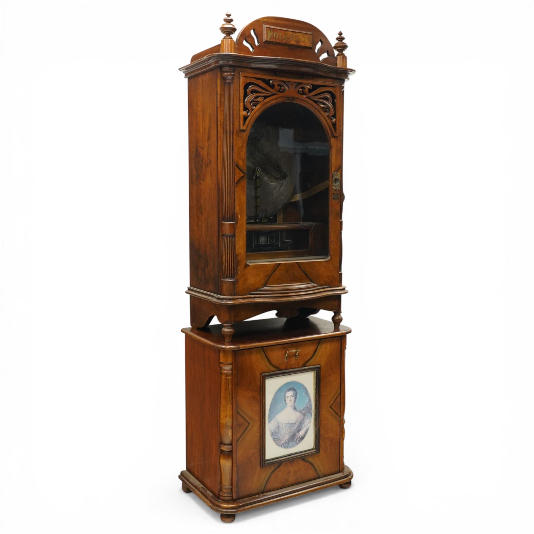 Late 19th century coin operated floor standing Polyphon, the shaped cornice marked 'Polyphon' with eleven 50cm discs in a walnut case with glazed upper section, the coin slot marked '1 Penny', the lower section with fall front for disc storage and inset with a portrait print and on compressed bun feet H230cm x W76cm x D46cm with a number of old pennies