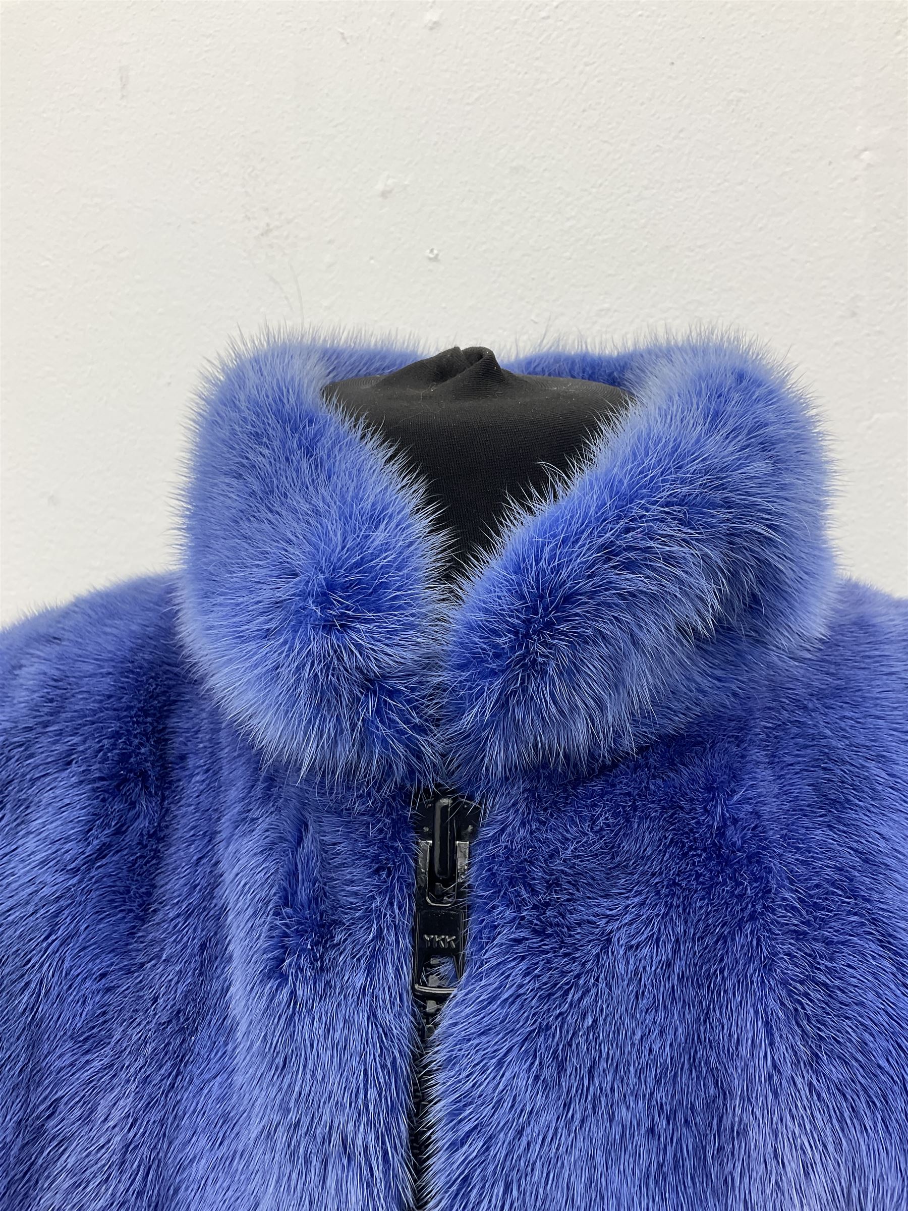 Modern cut lightweight skins lavender blue mink jacket, approx size 10 to 14, with elasticated cuffs, stand up small collar, black satin style lining, zip fastener, perfect condition as new, top class mink.
