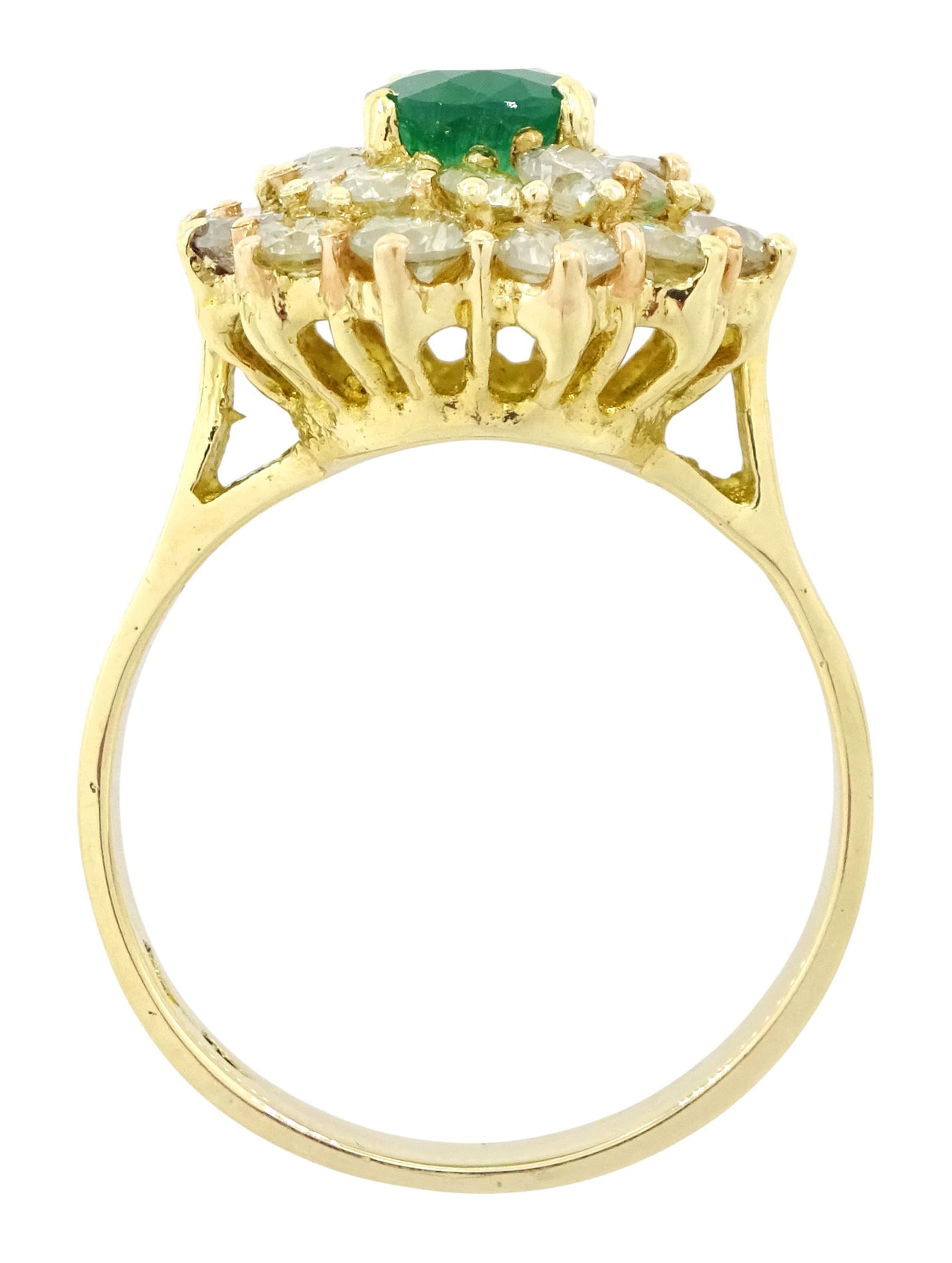 14ct gold emerald and diamond cluster ring, single oval cut emerald of approx 1.05 carat, surrounded by two rows of twenty four round brilliant cut light yellow diamonds, total diamond weight approx 2.35 carat