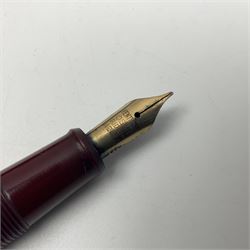 Four fountain pens, each with 14ct gold nibs, comprising Mentmore Paramount, Parker Junior Duofold, Conway Stewart marbleised pen and Waterman's, together with a 14ct gold Conway Stewart 5B nib