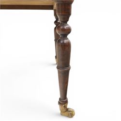 Late Victorian mahogany whatnot, the three tiers supported by turned spindle uprights with turned finials, fitted with a single frieze drawer, raised on turned supports with brass castors