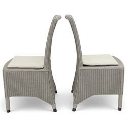 Neptune – Sheldrake limed oak extendable dining table and eight Havan loom chairs, the oval top in limed oak finish with four additional leaves extending the table to seat up to ten (Extends to cm), raised on turned legs with two additional centre supports, the matching Havan loom chairs finished in grey with cream upholstered seat covers (H 95cm, W 47cm, D 55cm)
