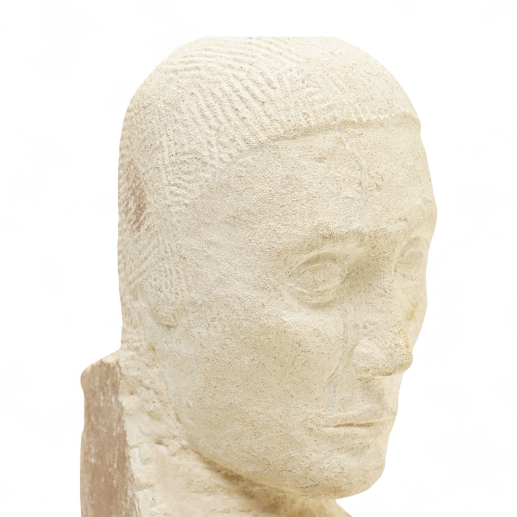 Modern carved limestone slab sculpture of the head of a man, H38cm 