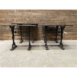 Four cast iron pub or bar tables with rectangular tops