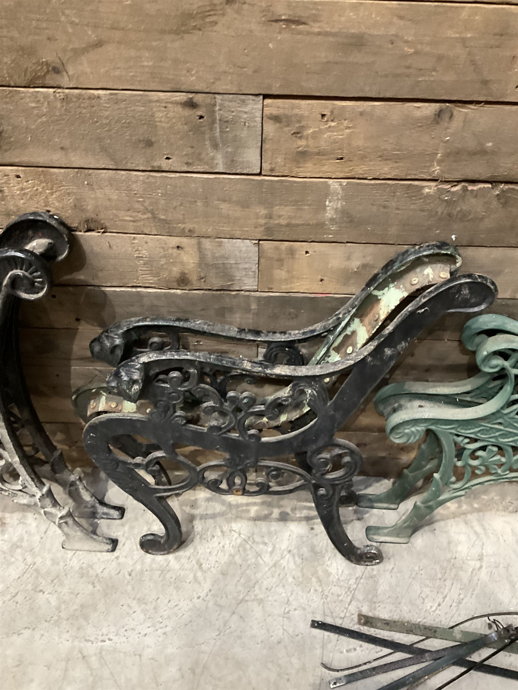 Four pairs of ornate cast iron bench ends (8)