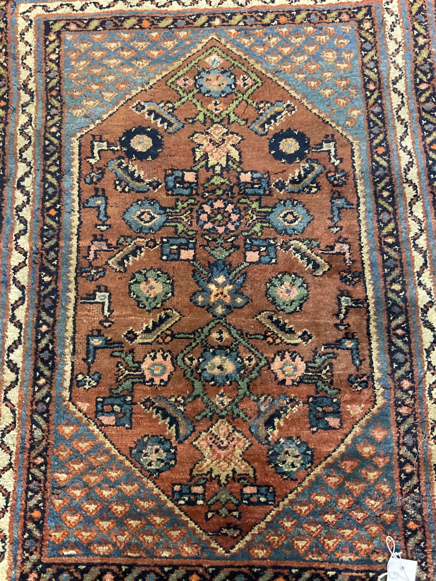Small Persian rug or mat, decorated with Herati motifs within pattern borders 