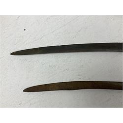 Late 19th/early 20th century Indian Tulwar sword with 81cm plain curving steel blade and iron hilt with extended langets, knucklebow and spiked pommel; in leather covered scabbard L100cm overall; and another Tulwar lacking scabbard in almost relic condition (2)