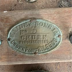 Two early 20th century dairy equipment items: Waide & Sons, Leeds – oak barrel butter churn with iron bands, later converted to electric operation, on trestle stand (W71cm H115cm); Lister – ‘Ball Bearing’ cast iron cream separator, with hopper and foot pedal, in red-painted finish (W47cm H49cm)
