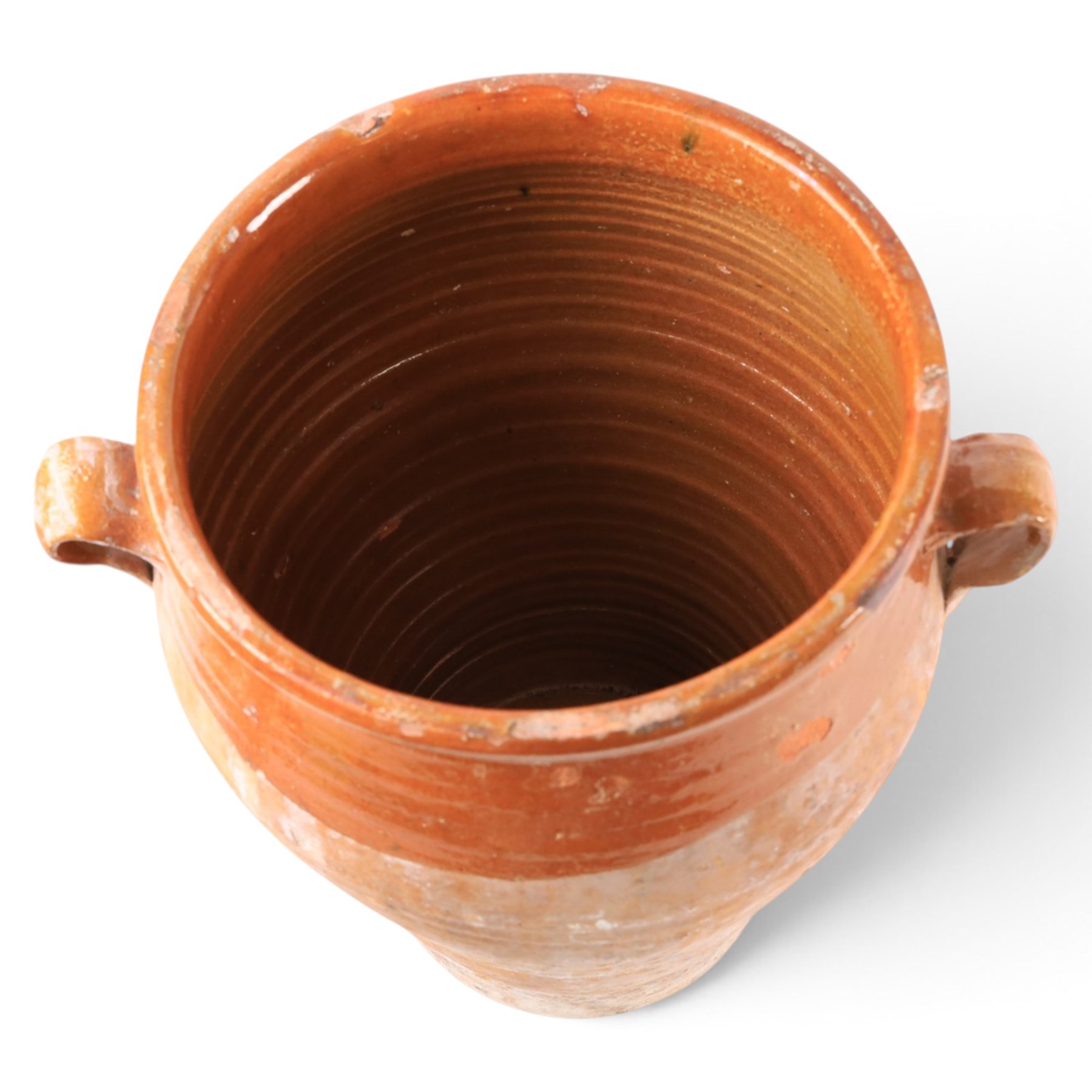 Spanish terracotta twin handled olive jar, of typical baluster form with orange glaze decoration, H34cm