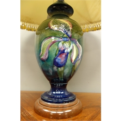  Moorcroft Orchid pattern classical shaped lamp vase on green ground and turned wood base, H32cm  