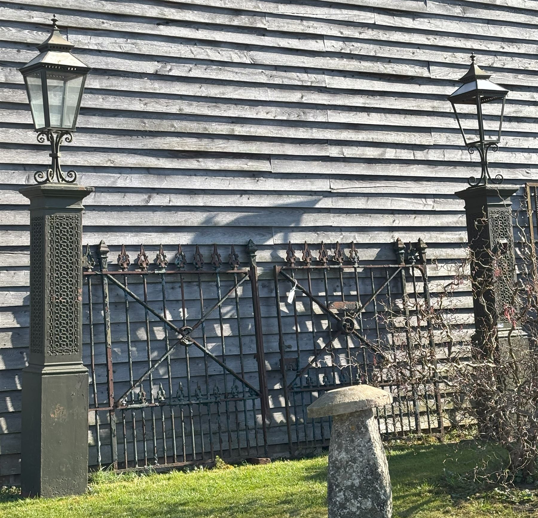 Impressive pair of 19th century cast iron gate piers by Coalbrookdale, each with a later lantern surmount on scrolled mount, above columns with blind fret strapwork decoration, on square section bases. Overall H350cm, Height excluding lanterns 220cm.  - COLLECTION BY APPOINTMENT FROM: The White House, Thirsk Road, Easingwold, York, YO61 3NF - CALL 01723 507111 TO ARRANGE