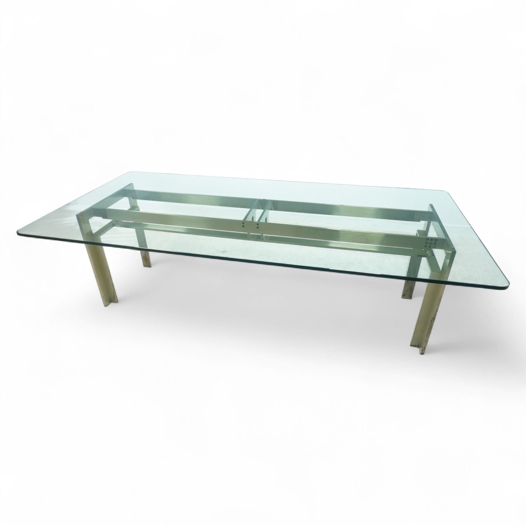 Carlo Scarpa for Studio Simon – 1970s Italian design dining table, the rectangular clear glazed top resting on a brushed steel and aluminium architectural base, with exposed bolt details and angled legs, maker's label with the designer's signature