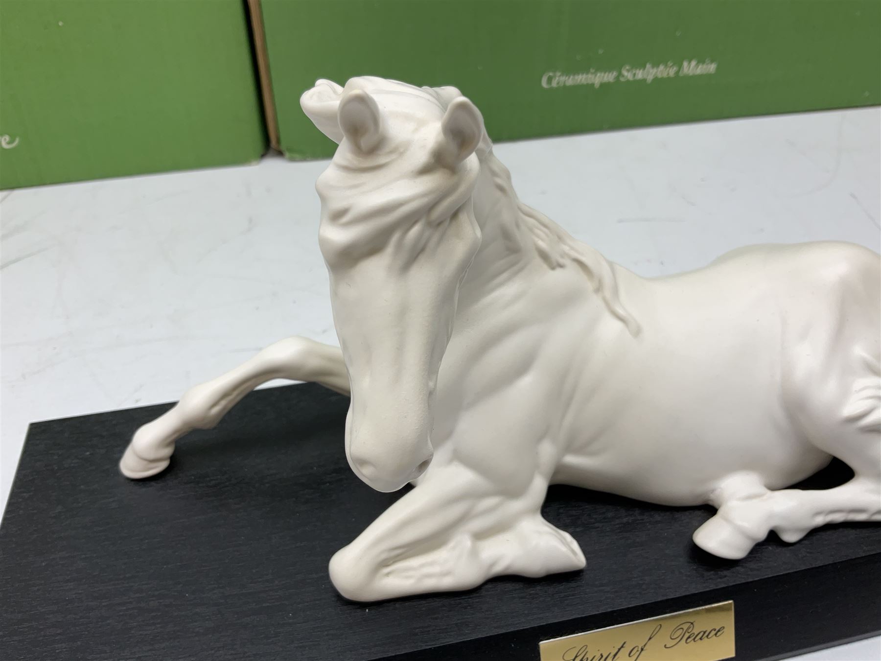 Five Beswick and Royal Doulton horse figures in matt white on black plinths, comprising of  Spirit of Affection no. 2689/2536, Springtime no.2837, Spirit of peace no.2916, Spirit of earth no.2914 and Spirit of the wild no. 183, together with a composite figure of a horse (6)