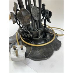 Art Nouveau Tiffany style table lamp, the bronzed base modelled as lily pads leading to tendrils and twelve branches supporting green and yellow glass lily flower shades, H53cm
