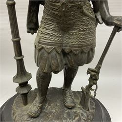 Pair of bronzed figure modelled as a hunter in traditional dress, each holding a pike, H48cm
