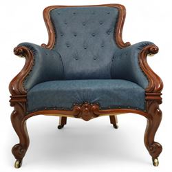 Fine pair of mid-19th-century mahogany library armchairs, carved frame with balloon-shaped back with scrolled ends, rolled wide arms, ending in a scrolled volute above a serpentine seat rail, upholstered in mottled turquoise faux leather, button upholstered back, arms, and cushion seat, studded sides and apron, raised on scroll carved front feet and splayed rear legs on castors 