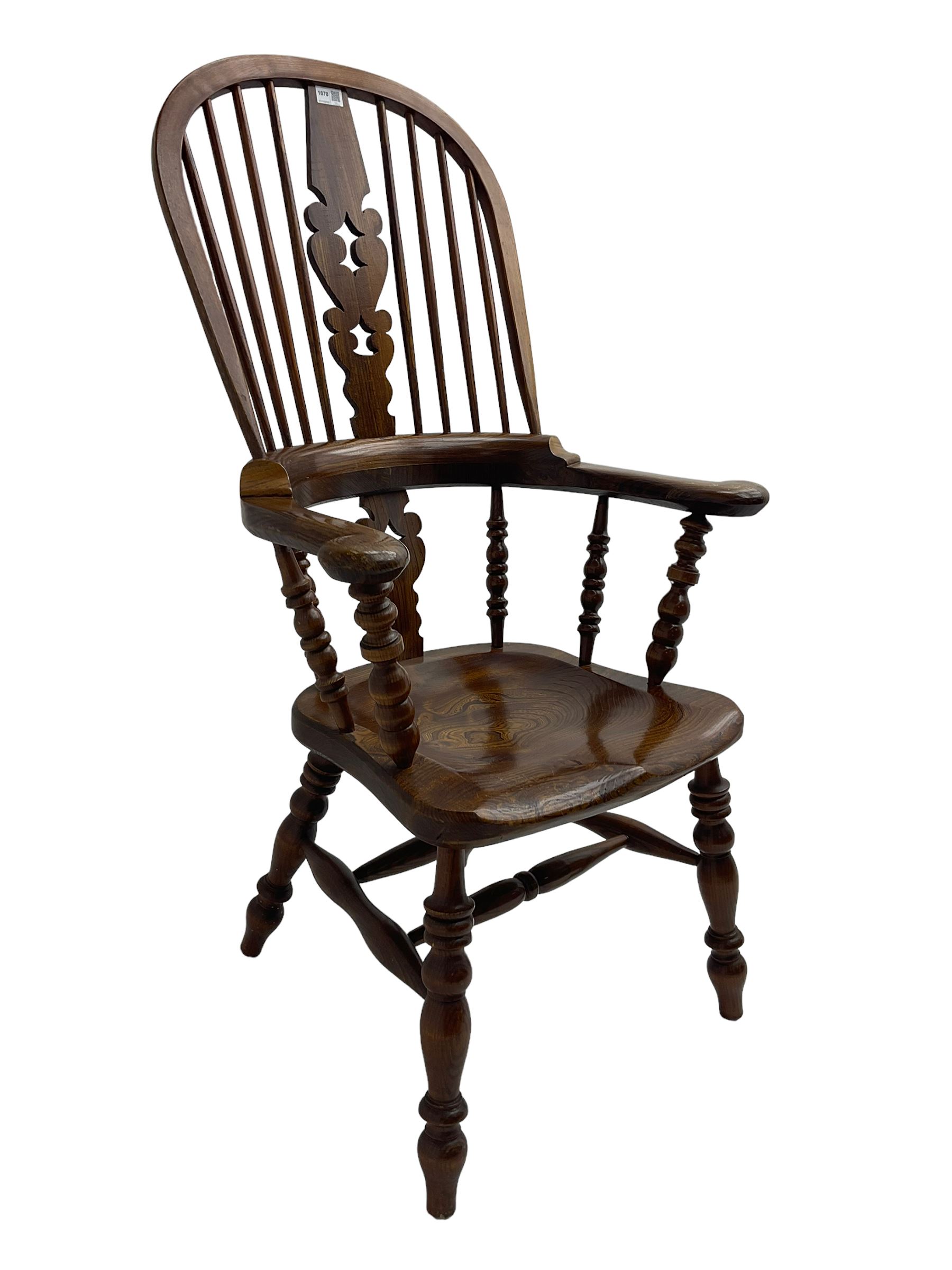 Traditional elm Yorkshire style Windsor armchair, high back with pierced and fret work splat, turned supports joined by double H stretcher