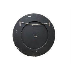 large quarts battery operated wall clock with an 18” dial and 30” painted wooden bezel, Roman numerals and baton hands.