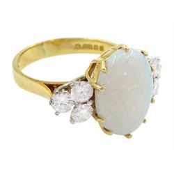 18ct gold opal and six stone round brilliant cut diamond ring, London 1977, opal approx 2.60 carat, total diamond weight approx 0.65 carat