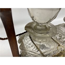 Edwardian oak tantalus with silver plated mounts with three square sided glass decanters, complete with key