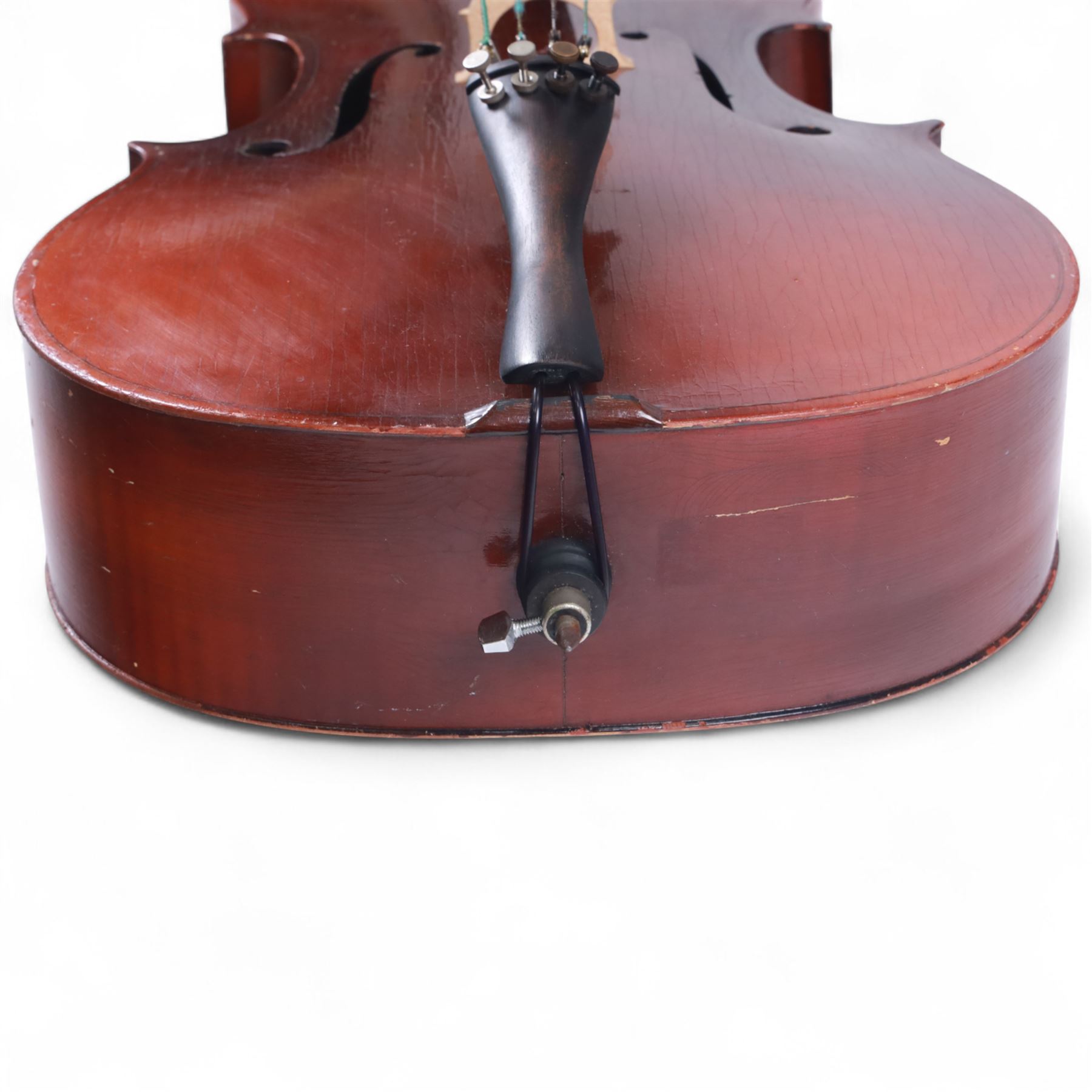 Czechoslovakian 3/4 size cello, with a one piece back, carved scroll neck with ebonised tuning pegs, fingerboard and tail piece, with strings and bridge, no bow. In a soft case.