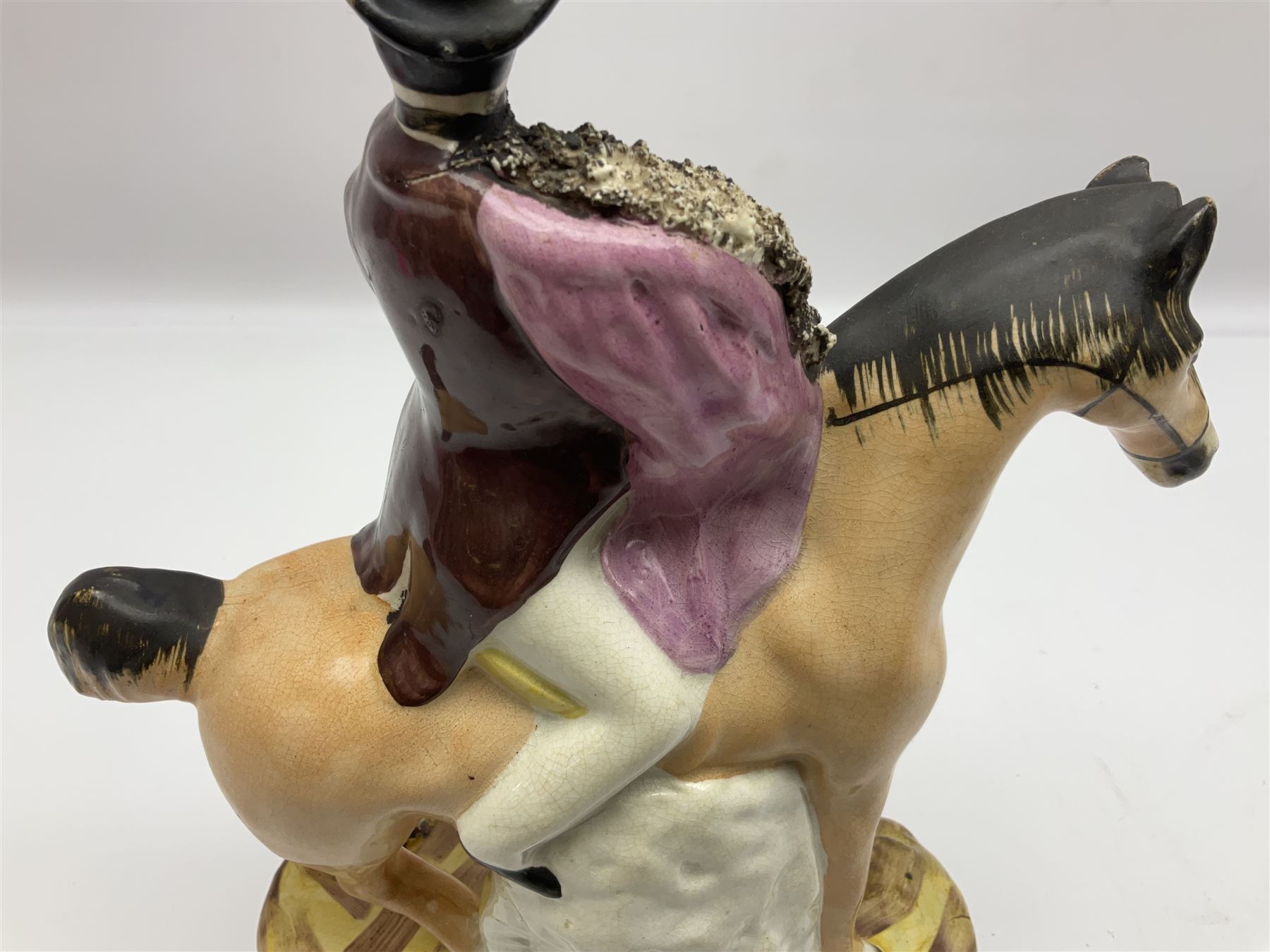 19th century Staffordshire figure of Robert Peel, titled 'Sir Robert Peel', modelled on horseback, atop an oval plinth base featuring a naturalistic and floral design, H30cm 