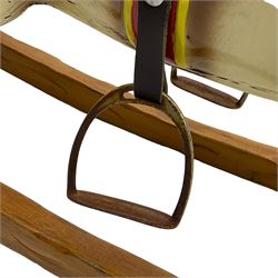 20th century rocking horse, painted body, glass eyes, metal stirrups and chain, wooden bow rocker