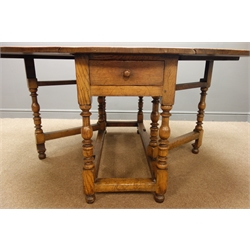  Early 20th century oak oval drop leaf gate action table, single drawer, turned supports joined by stretchers, 123cm, x 167cm, H76cm  
