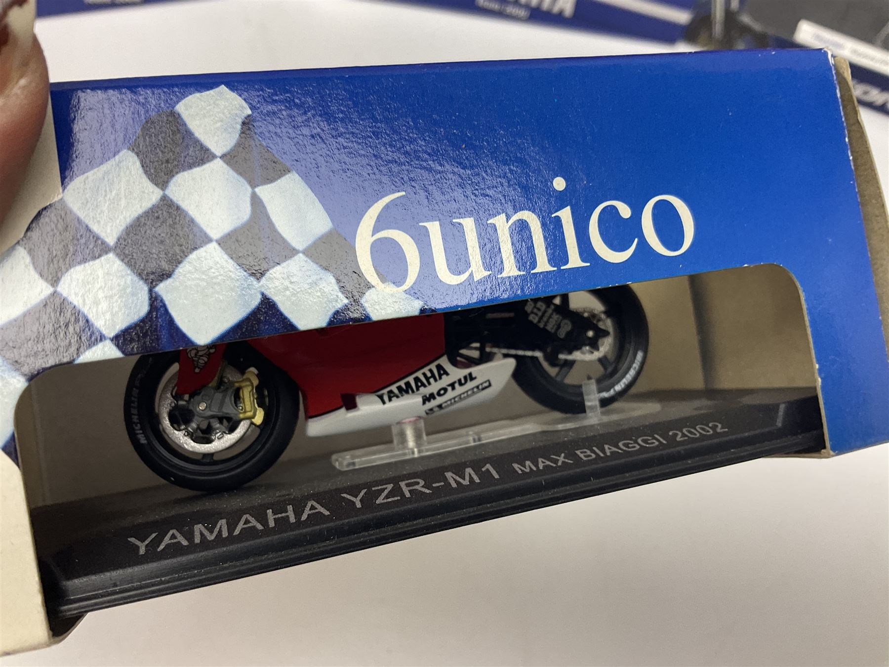 Fifty-one die-cast models of motorcycles by Maisto, Protar Italeri, Welly etc; many in perspex display boxes, some in window boxes and some unboxed