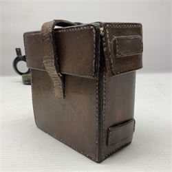 WWII British marching compass, the black lacquered brass case inscribed T.G.Co.Ltd. No.B100228 (broad arrow) 1941 Mk.III; and a ship's brass cased clinometer, the silvered dial marked R(arrow)L, D9cm; in leather carrying case (2)