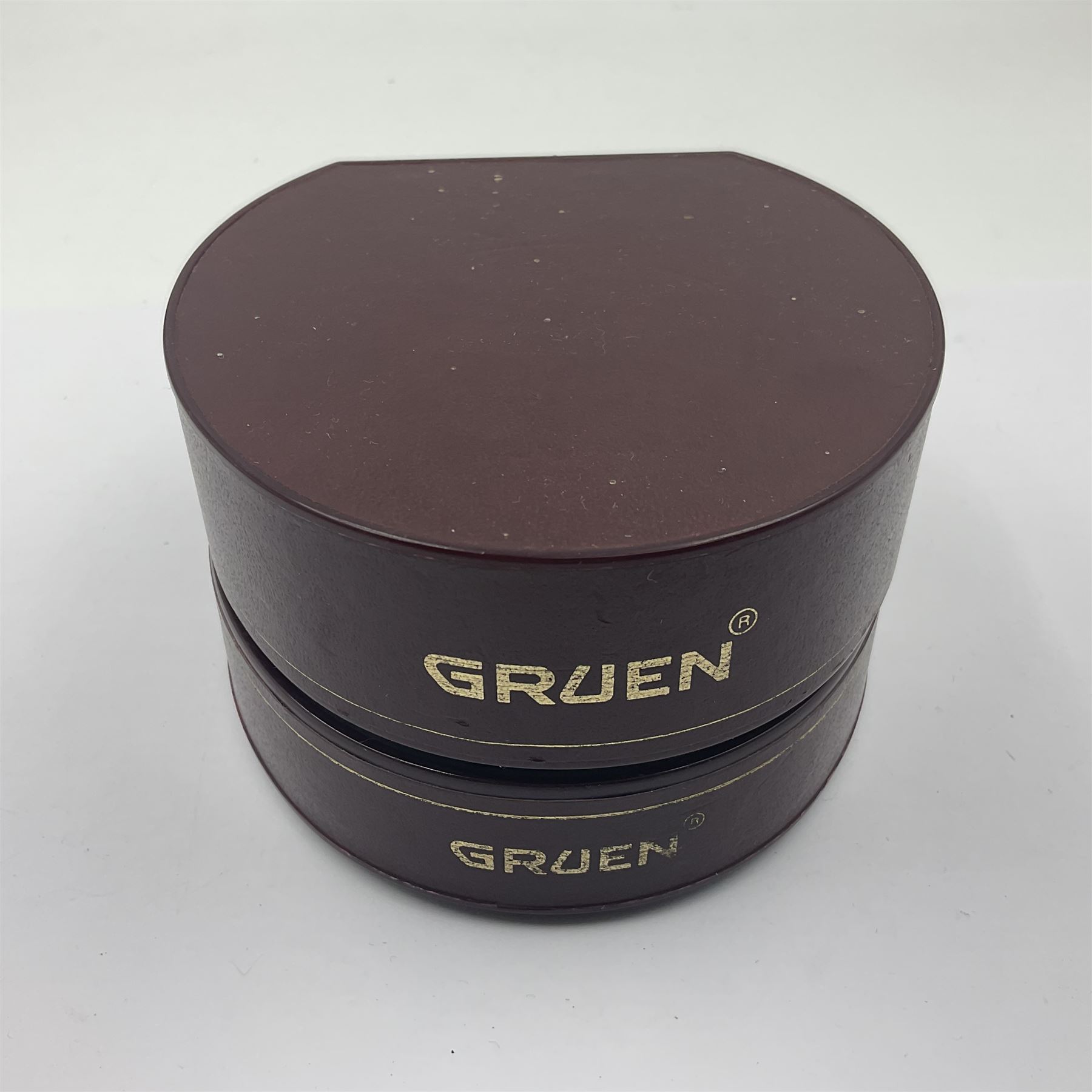 Gruen Precision gentleman's quartz wristwatch, with stone set black dial, on a stainless steel gilt metal strap, in original box