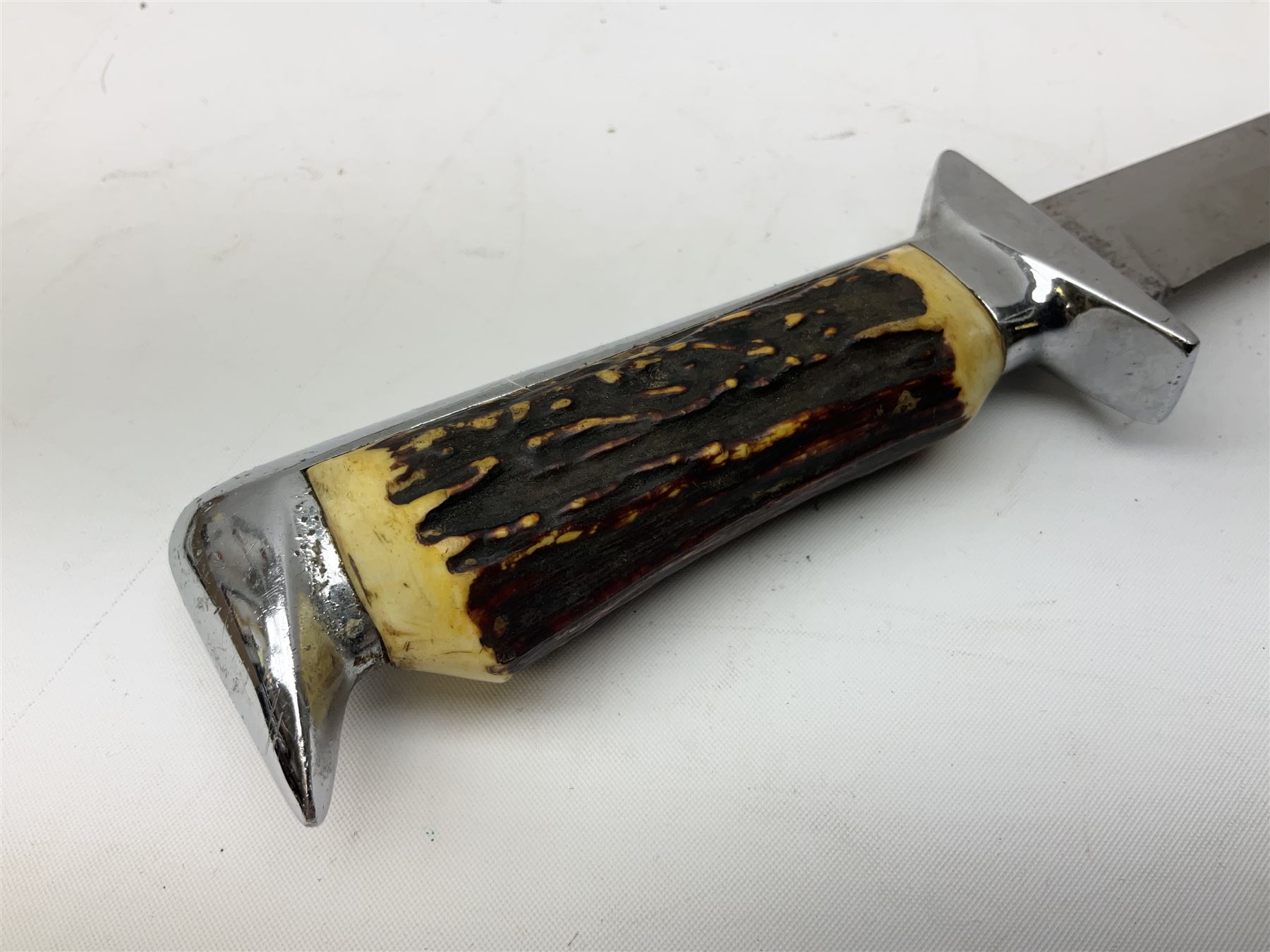 German ERN Wald-Solingen Art Deco style hunting knife with 13cm Bowie type blade and chrome fittings with antler grip; in leather sheath L24.5cm overall; and Bianchi Rastignano Aeronautica Militare combat knife with 15.5cm Bowie type saw-back blade and stacked leather grip (2)