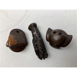 Group of ten Japanese netsukes, comprising eight carved wooden examples, and two ivorine examples, of various form, examples modelled as pigs, owl, mouse with tortoise upon its back, birds, rabbit, etc. 