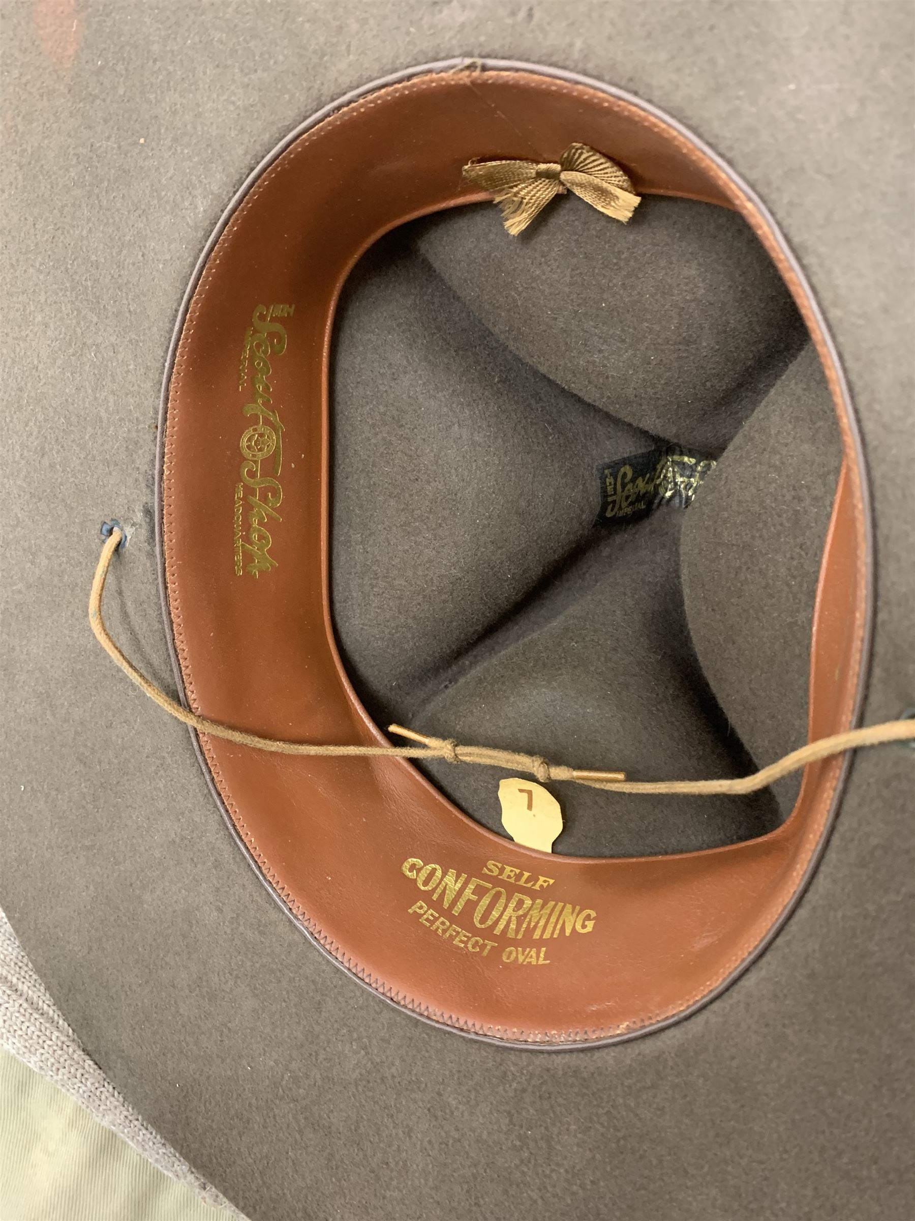 Mid 20th century Boy Scouts uniform, comprising corduroy shorts, further pair of shorts, two shirts, socks, and felt hat, together a framed collection of Ogden's 'Boy Scots' cigarette cards, and an unframed print of Lord Baden Powell. 