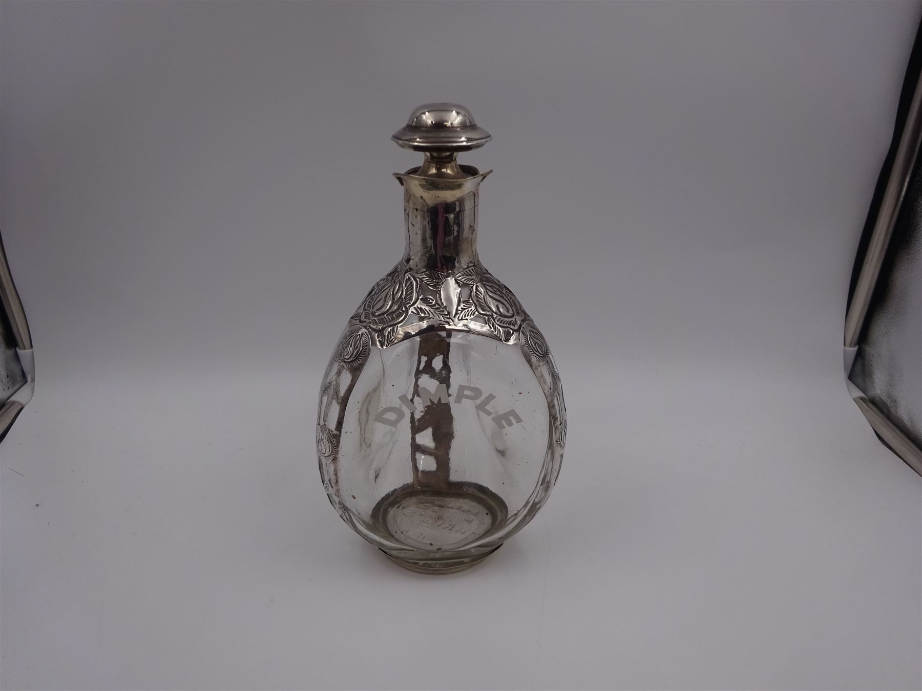 20th century Mexican silver overlaid Dimple whisky decanter/jug with stopper, the glass body overlaid with pierced floral silver decoration, with silver C handle and silver stopper, stamped 925 to base, H23.5cm