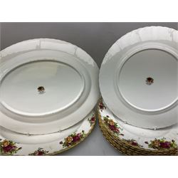 Royal Albert 'Old Country Roses' pattern tea and dinner service for eight, to include dinner plates, cereal bowls, teacups and saucers, oval serving dishes, cake plate, sauce boat and stand, placemats, pair of candlesticks, etc