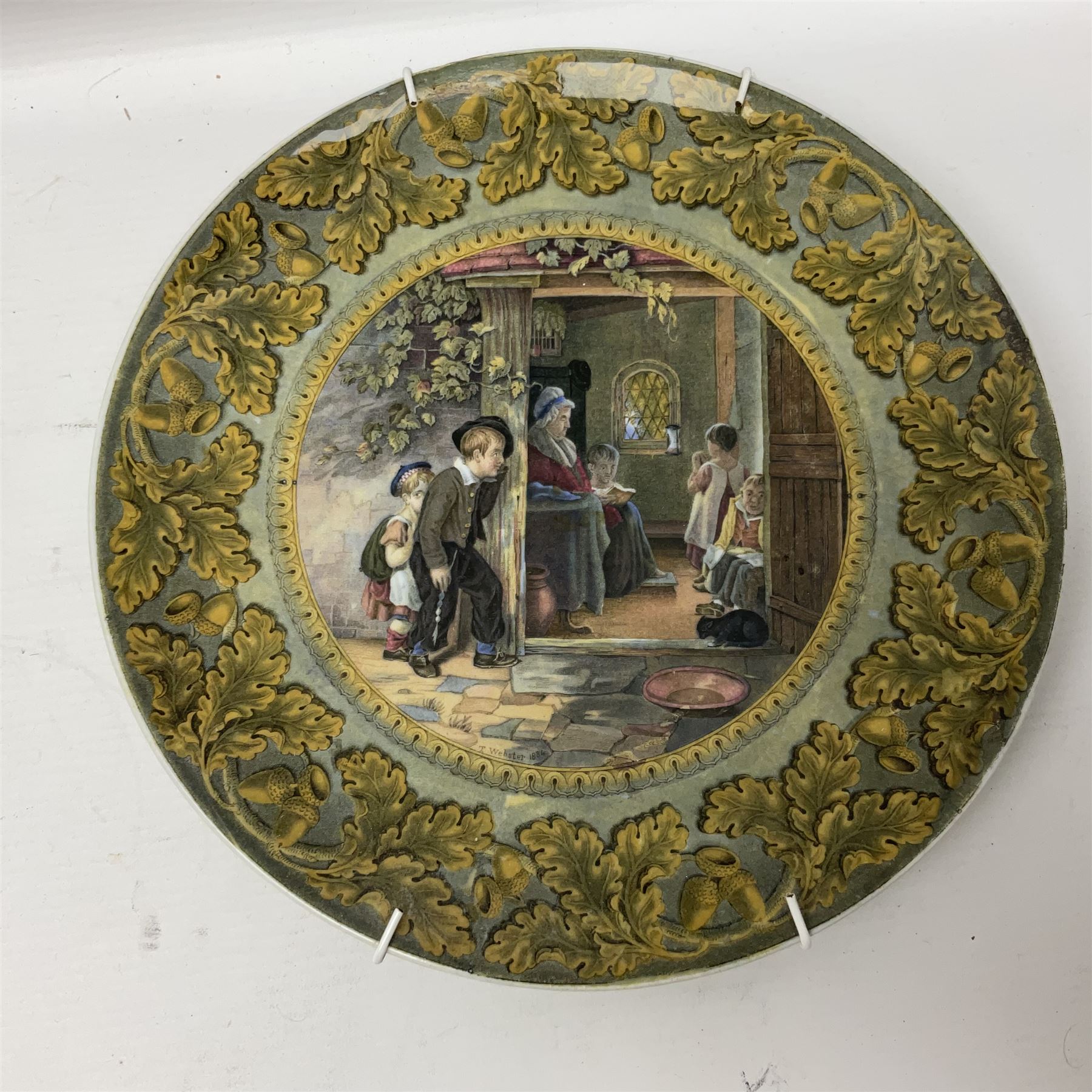 19th century Prattware table ware to include an oval footed dish decorated with a scene after Landseer 'Highland Music', retailed by James Muggleton L27.5cm, ‘The Truant’ plate after T. Webster, 'Blind Man's Buff' & 'Snap Dragon' tea plate, two side plates with malachite printed borders and others (17)