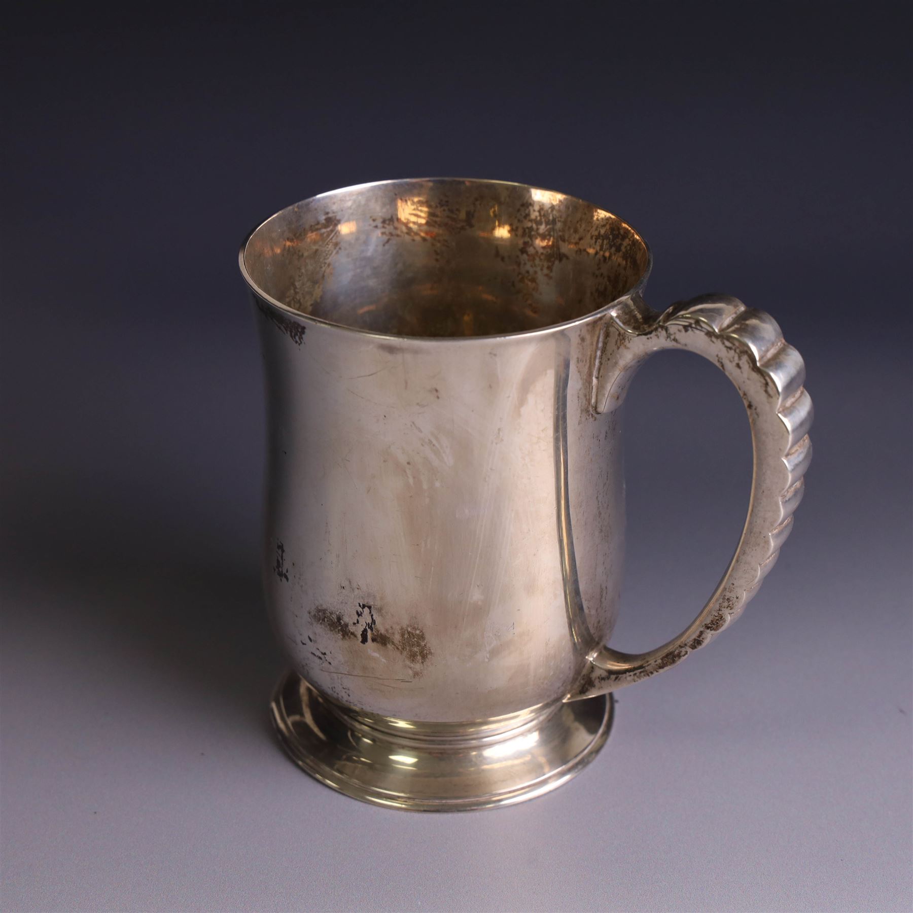 1930s silver tankard, of typical bellied form upon a circular base with ribbed handle, the body with presentation engraving, hallmarked Mappin & Webb Ltd, Sheffield 1937, H12cm