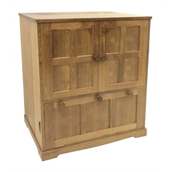 'Lizardman' panelled oak cabinet fitted double cupboard above two fall front compartments, with presentation plaque 'Presented on their retirement... from the staff and children at St. Martin's school', by Derek Slater of Crayke, W92cm, H99cm, D47cm