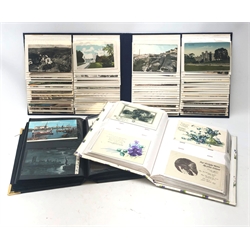  Three modern albums containing a total of over four hundred and fifty Edwardian and later postcards, predominantly British topographical with some greetings, children etc  