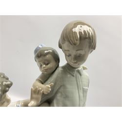 Two Lladro figures, comprising Only The Beginning, no 5547 and Back To School, no 5702, both with original boxes, largest example H25cm