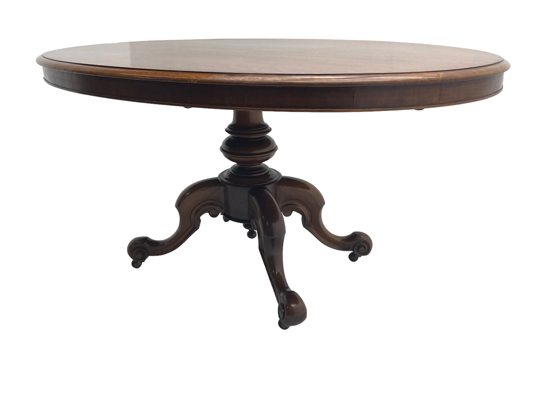 Victorian mahogany oval loo table, moulded edge with banded frieze, raised on baluster turned pedestal with quadrupod base, cabriole supports with scroll feet and castors