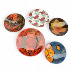 Three Poole pottery chargers, in Wild Po