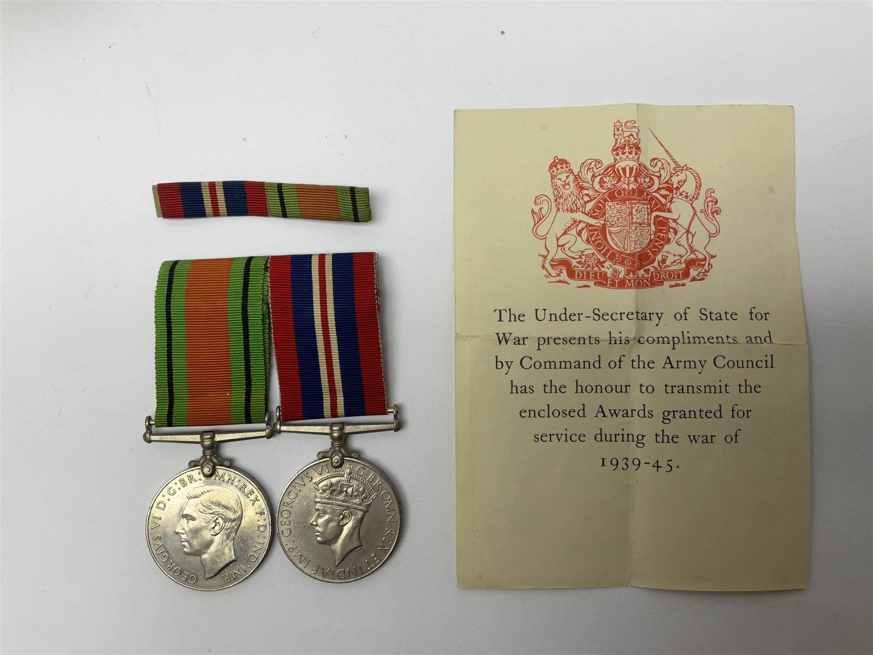 Twelve WW2 medals comprising four 1939-1945 war medals, four Defence medals, three 1939-1945 Stars and Africa Star; all with ribbons; some as groups in two issue boxes with slips